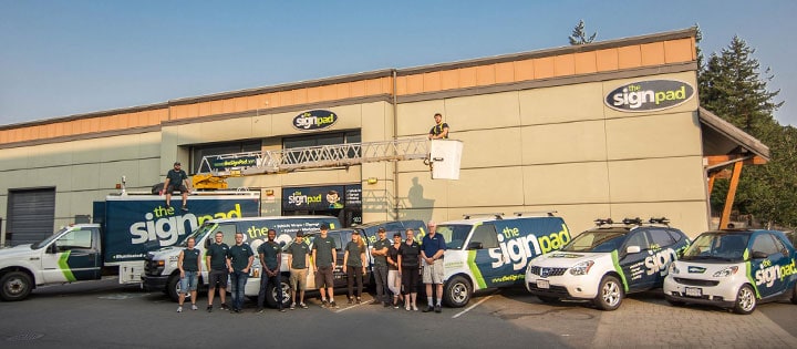 Custom signs and vehicle wraps displayed outside Sign Pad in Victoria.