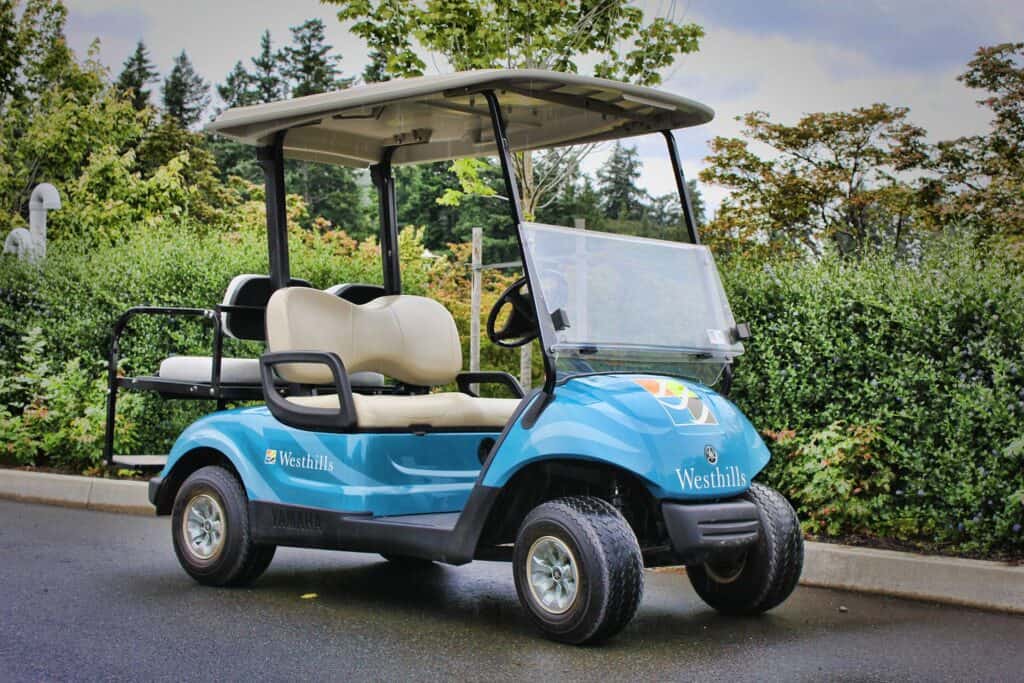Golf cart with custom signage for Westhills. Perfect for transportation around golf courses or resor.