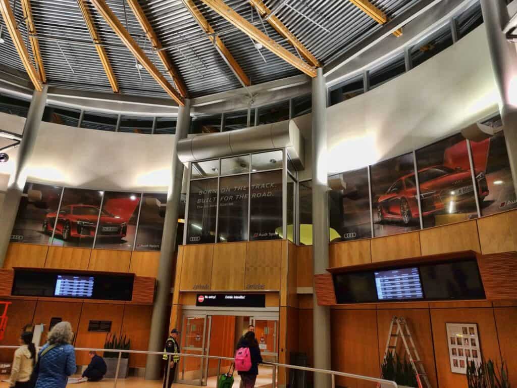 Custom sign and vehicle wrap display at Victoria airport.