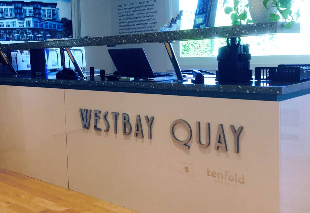 Westbay Quay custom sign on office reception desk.