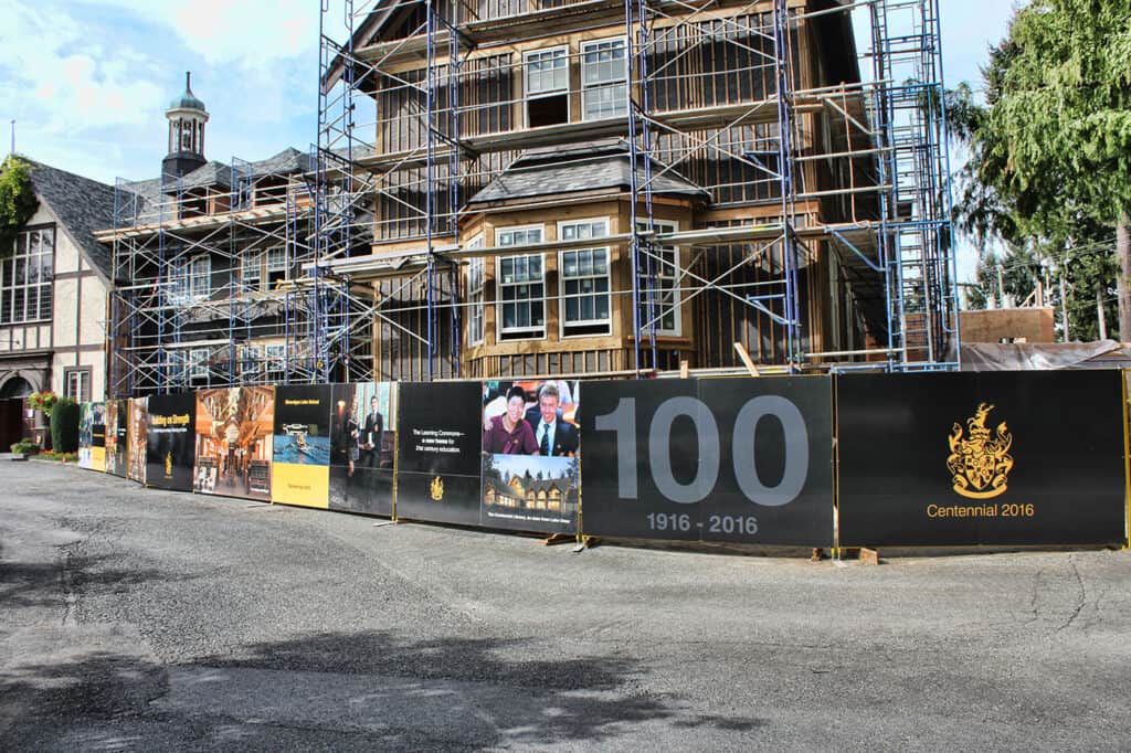 Large outdoor banners displaying Centennial 2016 celebration and historical images.