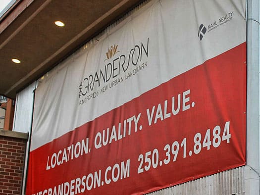 Custom outdoor sign for The Granderson with contact info in Victoria.