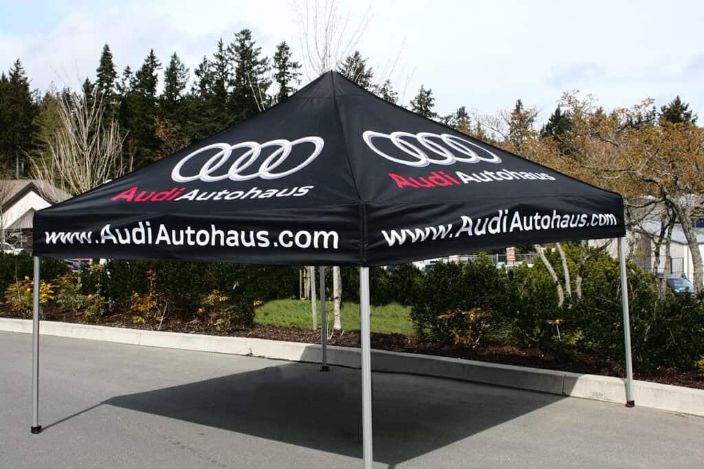 Custom Audi Autohaus branded tent for vehicle wraps and signage in Victoria.