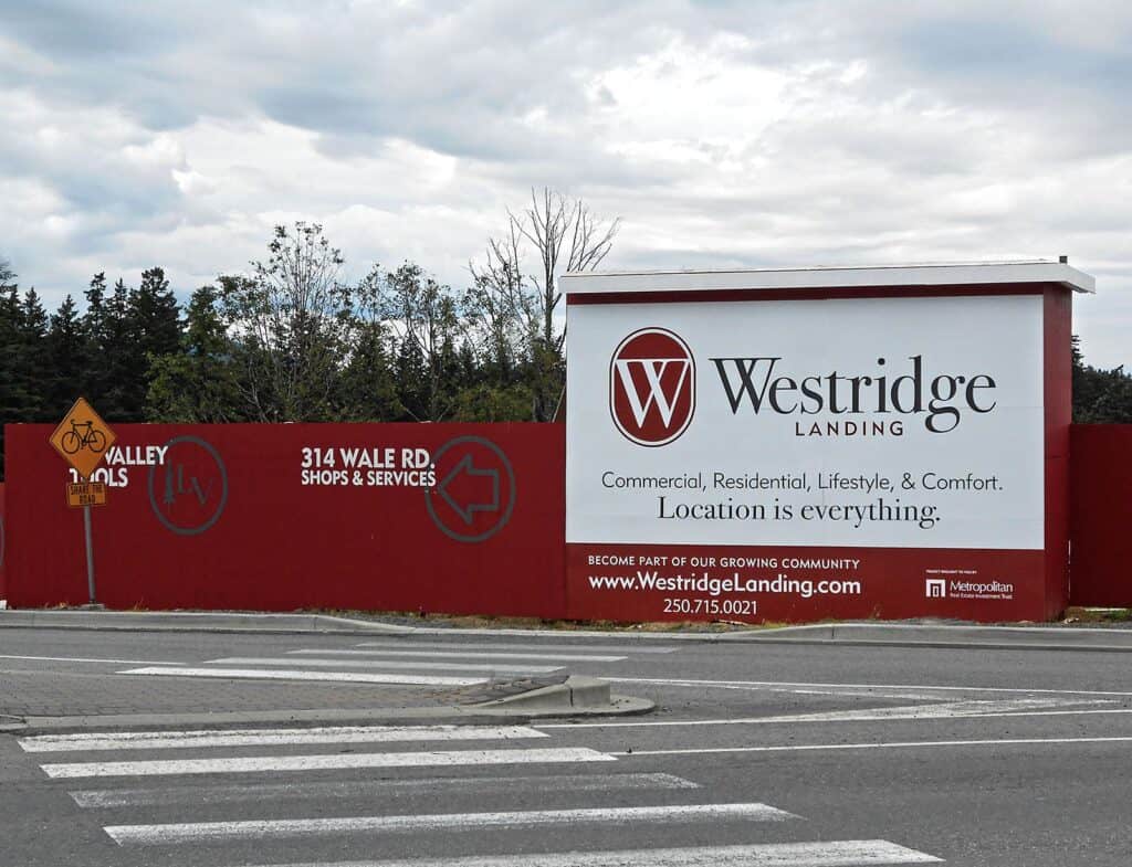 Westridge Landing commercial sign on red fence in Victoria, BC.