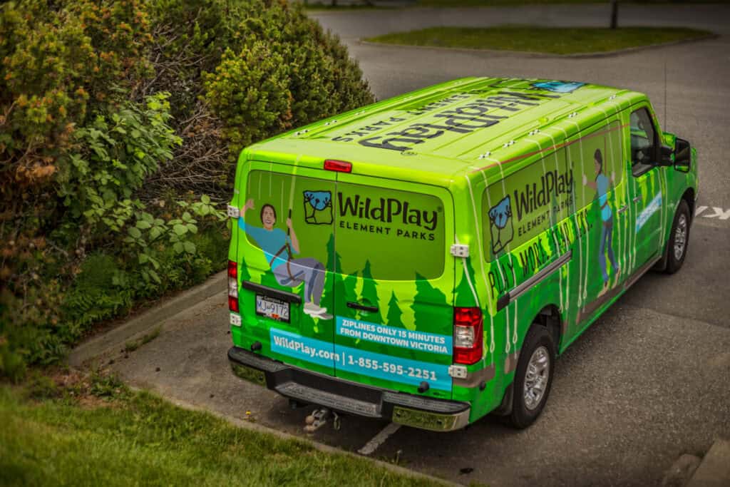 Bright green WildPlay vehicle wrap promoting adventure parks in Victoria.