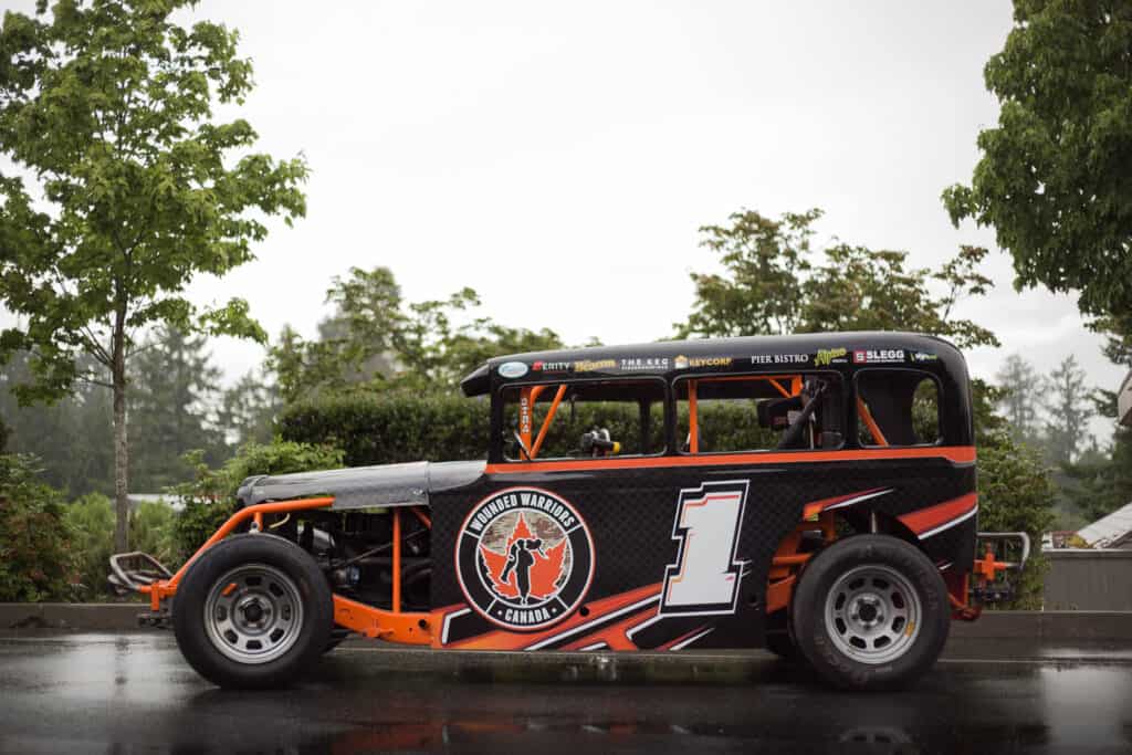 Vintage race car with custom graphics and number 1.